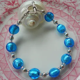 Bracelet with turquoise (blue) Murano glass mini lentil beads on silver beads and clasp